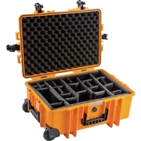 'Ortlieb-Hardcase' aus orangefarbenem Hartplastik mit offenem Deckel, zeigt gepolsterte, verstellbare Fächer für sicheren Transport.